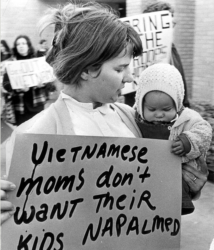 Nurse with baby and sign